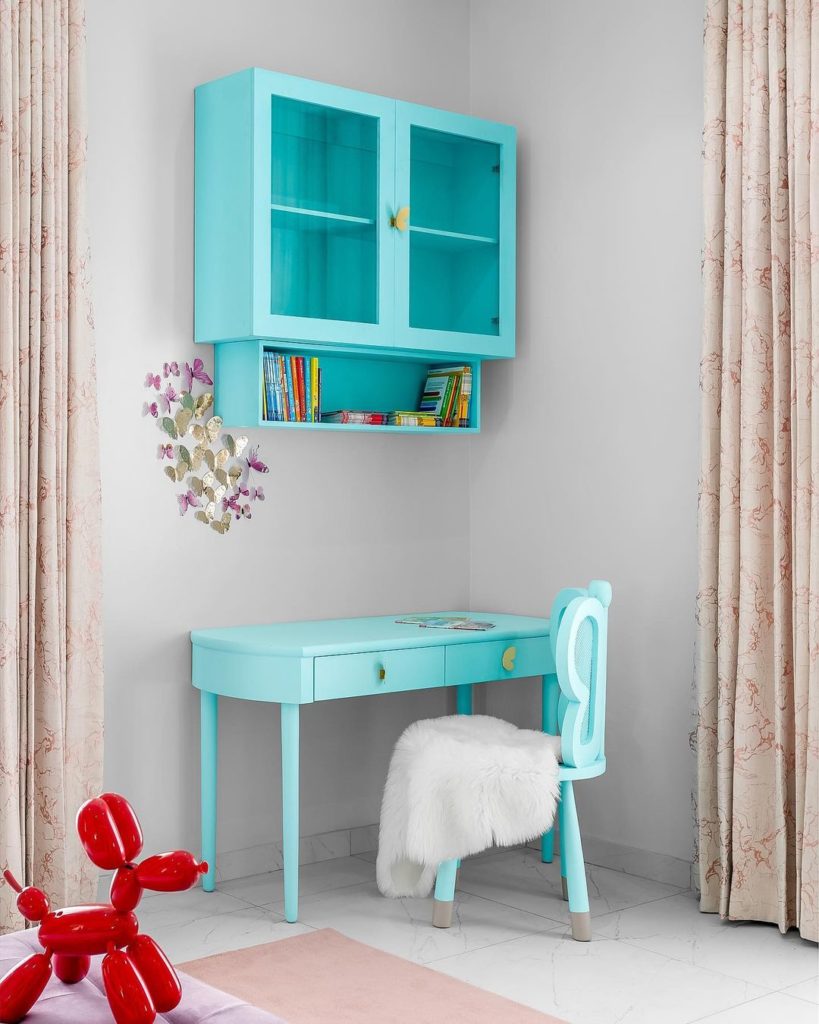 Torquoise blue dresser in the colourful girl's bedroom designed by Numi Design house.