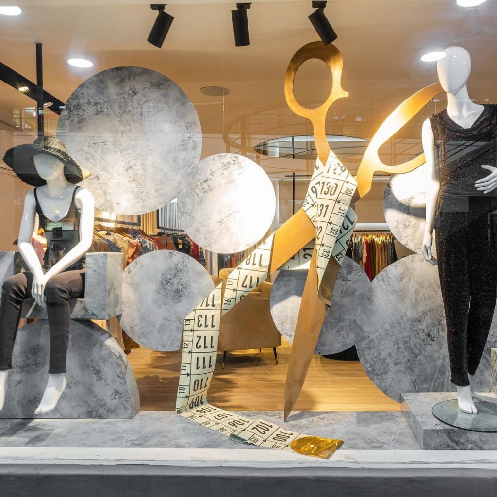 Creative window display at Besaz Boutique by HOA Interiors - inspired by the tailoring process