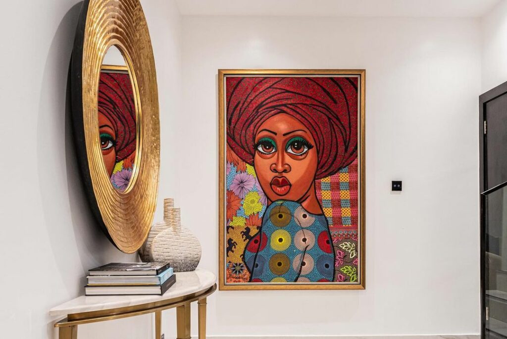 Bold African art in the living room by Design by C.Williams.