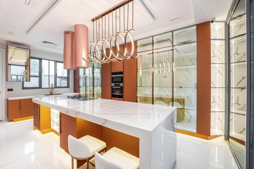Another view of the stylish and modern rose gold kitchen by Rome Signature.
